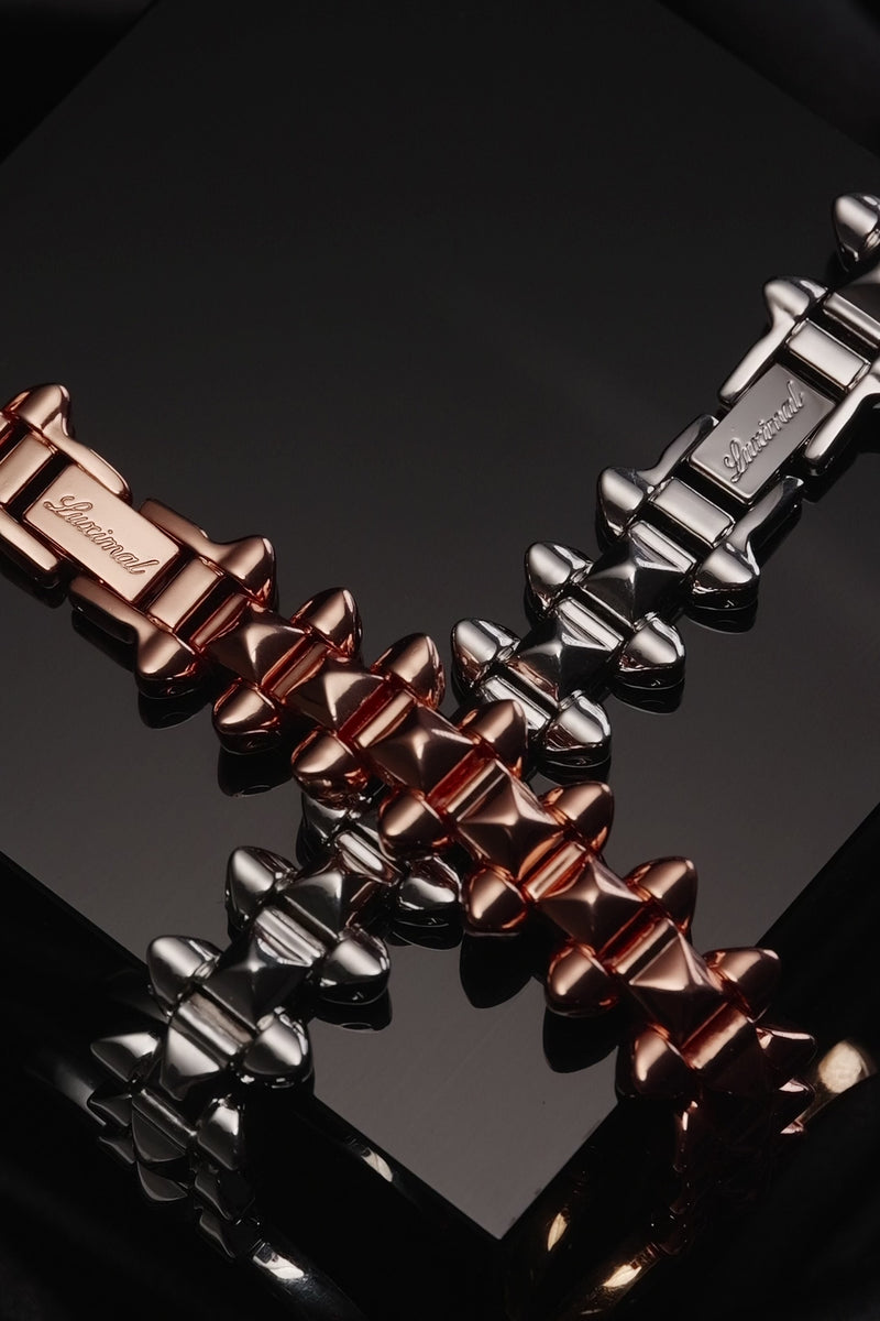 Video of Luximal Apple Watch band: Silver/rose gold with mixed cone/tower rivets, smooth edges. Unisex, fits street/light luxury outfits, ideal for young consumers into personalized avant-garde design.