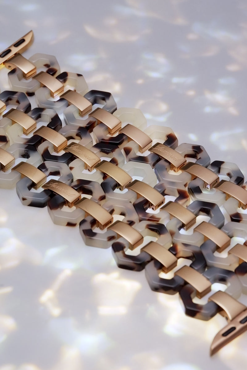 The video show  uximal Smoky Amber Hex  AppleWatch Band. Redefine your Apple Watch with this light weight strap featuring a hexagonal honeycomb design, framed in stainless steel with smoky amber eco-resin.