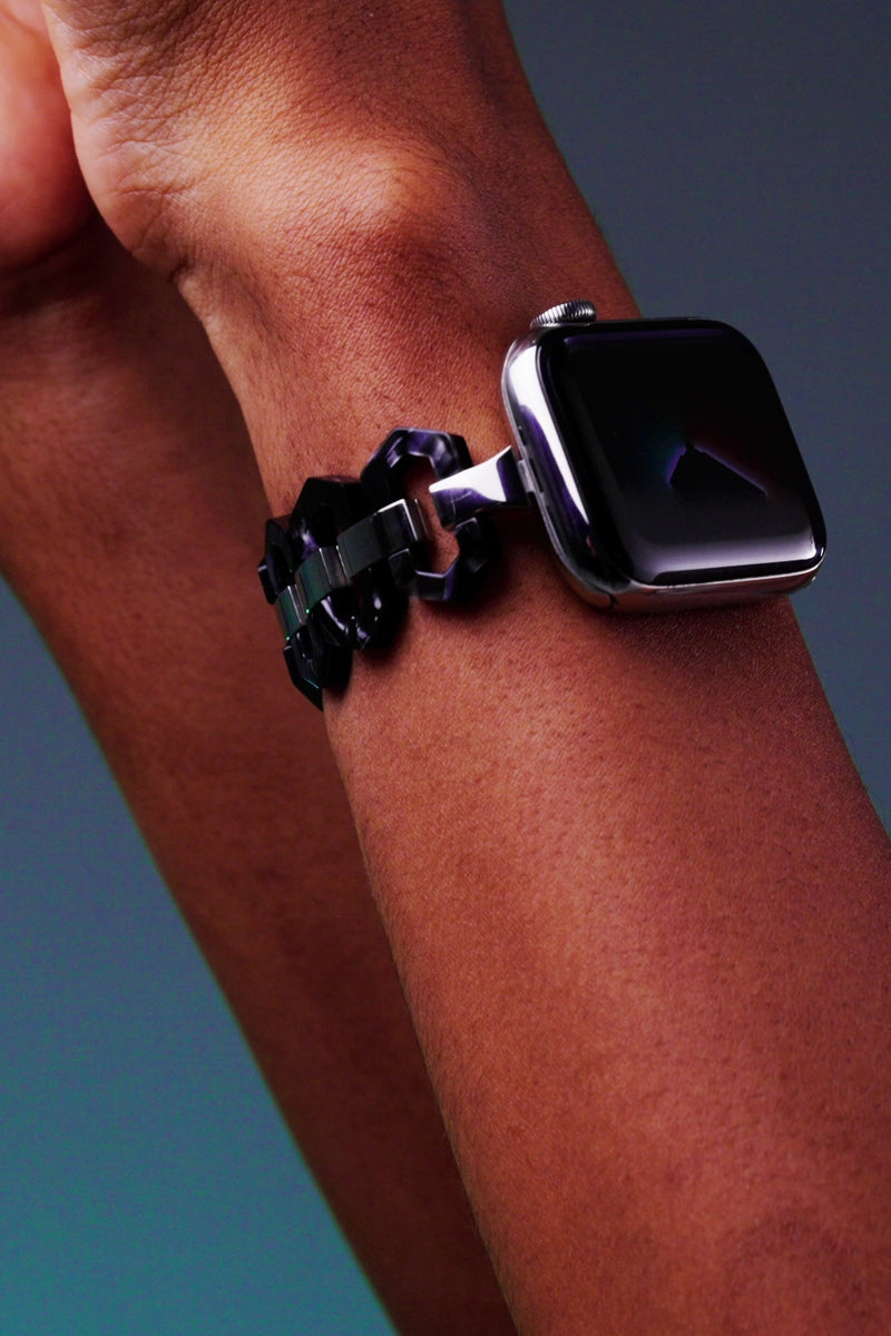 The video shows Luximal Obsidian Resin Hex-Link Bracelet Band For Apple Watch.Tough acetate (eco-resin) and stainless steel, modular-built: light, durable, easy to switch. 